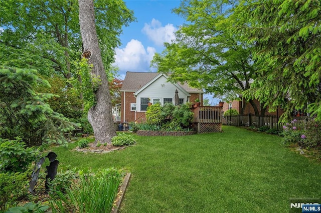 view of yard with a deck