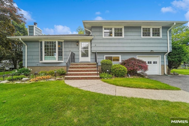 7 Swan Ter, Wayne, NJ 07470 - split level home with a front lawn, a garage, a chimney, and asphalt driveway