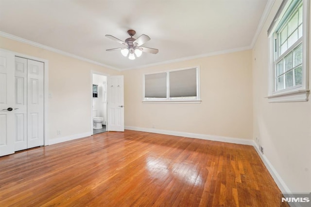 7 Swan Ter, Wayne, NJ 07470 - unfurnished bedroom featuring wood finished floors, baseboards, crown molding, ensuite bathroom, and a closet