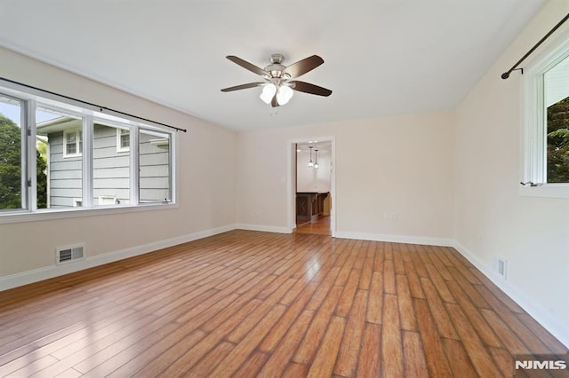 7 Swan Ter, Wayne, NJ 07470 - unfurnished room with a ceiling fan, plenty of natural light, and wood finished floors