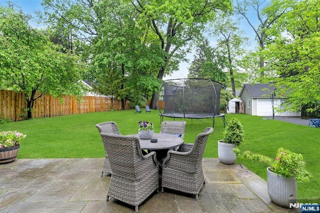 121 Beverly Rd, Montclair, NJ 07043 - view of patio with a trampoline, a storage unit, an outdoor structure, and outdoor dining space