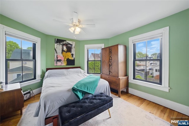 51 Maple St, Rutherford, NJ 07070 - bedroom featuring multiple windows, baseboards, and wood finished floors