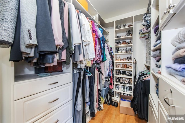 walk in closet featuring light wood-type flooring