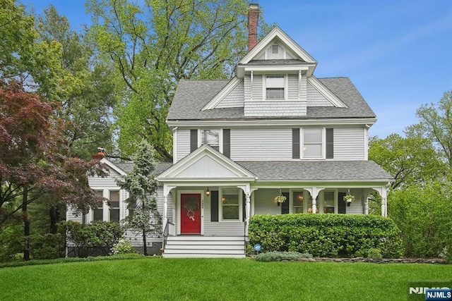 125 Bellevue Ave, Montclair, NJ 07043 - view of front facade featuring a shingled roof, a front lawn, a porch, and a chimney