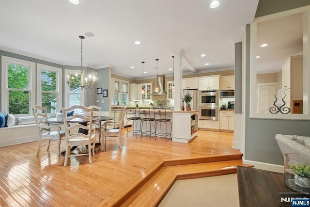 125 Bellevue Ave, Montclair, NJ 07043 - dining room featuring light wood-style flooring, ornamental molding, a chandelier, recessed lighting, and baseboards