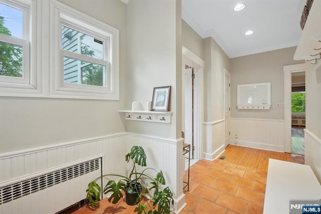 125 Bellevue Ave, Montclair, NJ 07043 - hallway with radiator heating unit, a wainscoted wall, plenty of natural light, recessed lighting, and tile patterned flooring