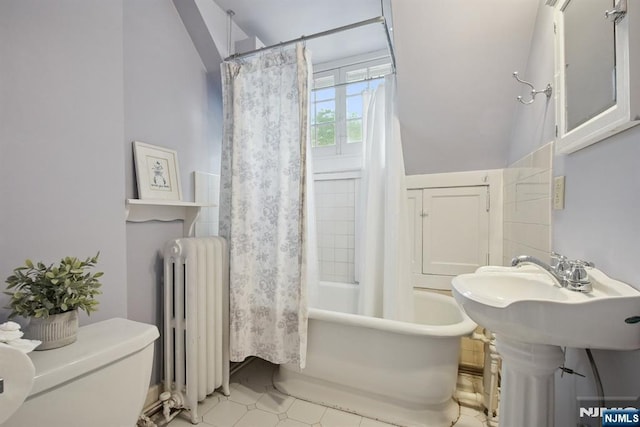125 Bellevue Ave, Montclair, NJ 07043 - bathroom featuring radiator heating unit, toilet, shower / tub combo, and tile patterned flooring
