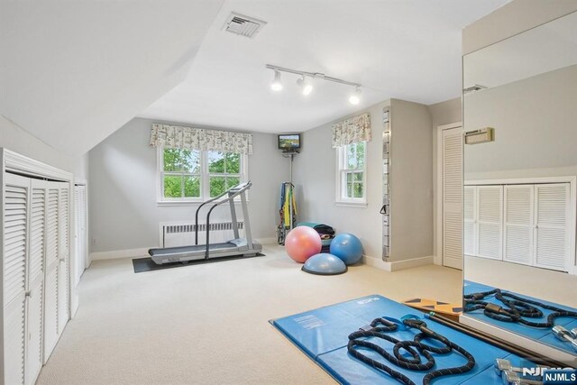 125 Bellevue Ave, Montclair, NJ 07043 - workout area with radiator heating unit, rail lighting, baseboards, and carpet