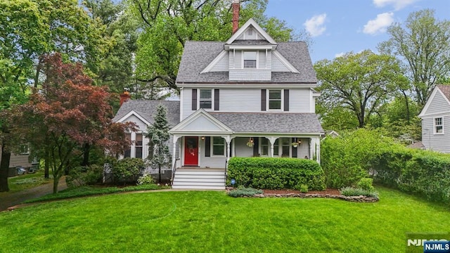 125 Bellevue Ave, Montclair, NJ 07043 - view of front of home with covered porch, a shingled roof, and a front yard