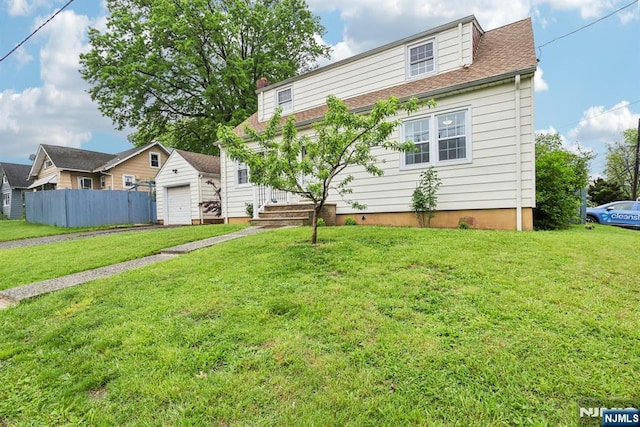 520 Elm St, Roselle Park, NJ 07204 - view of front facade with an outdoor structure, a detached garage, and roof with shingles