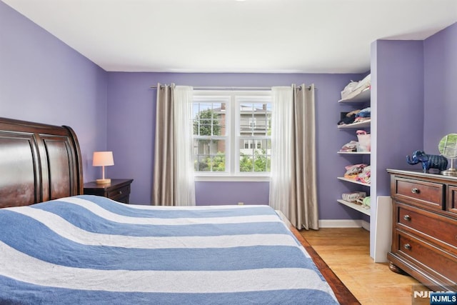 520 Elm St, Roselle Park, NJ 07204 - bedroom with light wood-type flooring and baseboards