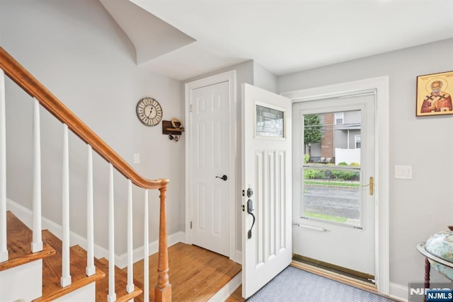 520 Elm St, Roselle Park, NJ 07204 - entrance foyer with stairway, baseboards, and light wood-style flooring