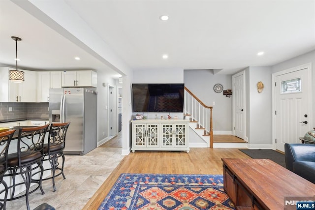 520 Elm St, Roselle Park, NJ 07204 - living room featuring stairs, recessed lighting, baseboards, and light wood finished floors