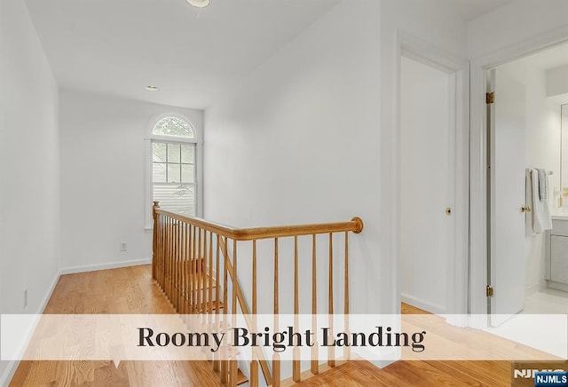 370 Chesterfield St, Ridgewood, NJ 07450 - hallway with an upstairs landing, wood finished floors, and baseboards