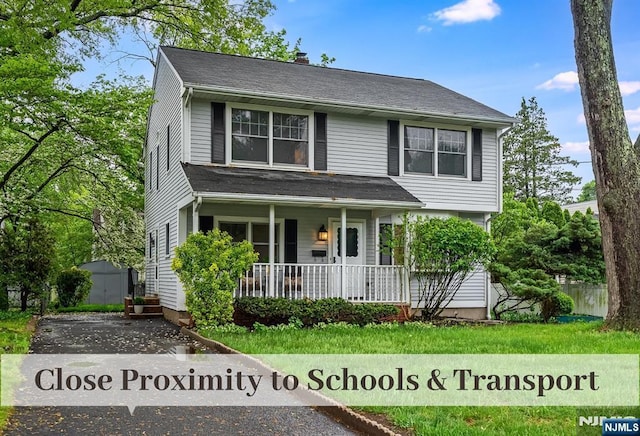 370 Chesterfield St, Ridgewood, NJ 07450 - view of front of home with a porch and a chimney