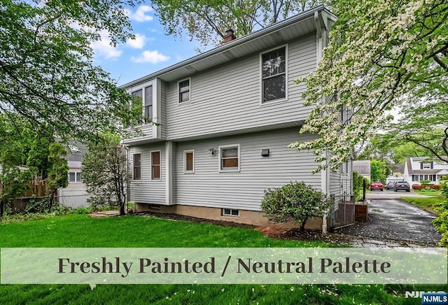 370 Chesterfield St, Ridgewood, NJ 07450 - rear view of property with a chimney