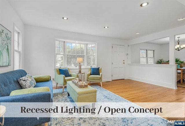 370 Chesterfield St, Ridgewood, NJ 07450 - living room featuring wood finished floors, healthy amount of natural light, recessed lighting, a chandelier, and baseboards