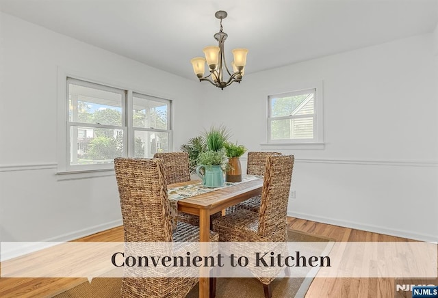 370 Chesterfield St, Ridgewood, NJ 07450 - dining room featuring a chandelier, wood finished floors, and baseboards