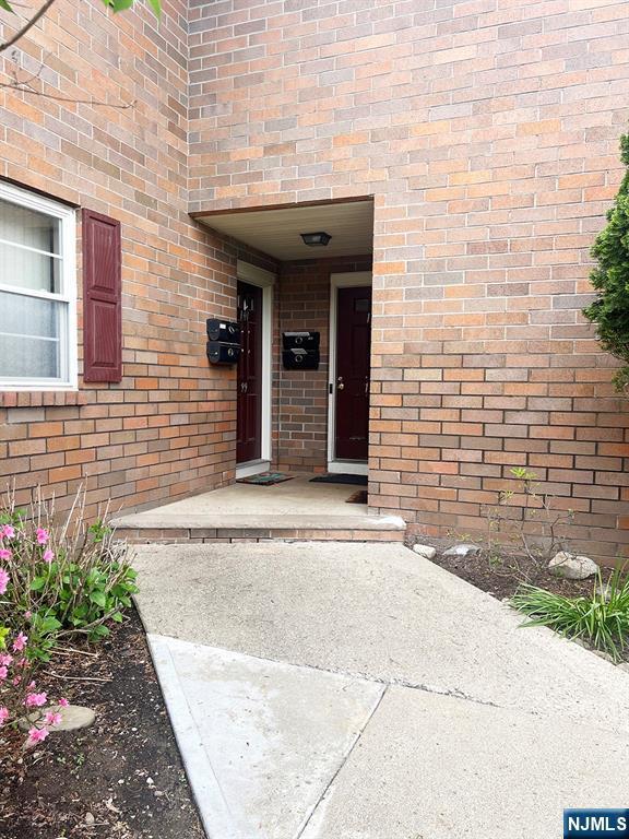 109 N Maple, Park Ridge, NJ 07656 - view of exterior entry featuring brick siding