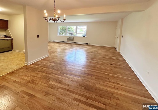 109 N Maple, Park Ridge, NJ 07656 - unfurnished dining area with light wood finished floors, a chandelier, and baseboards