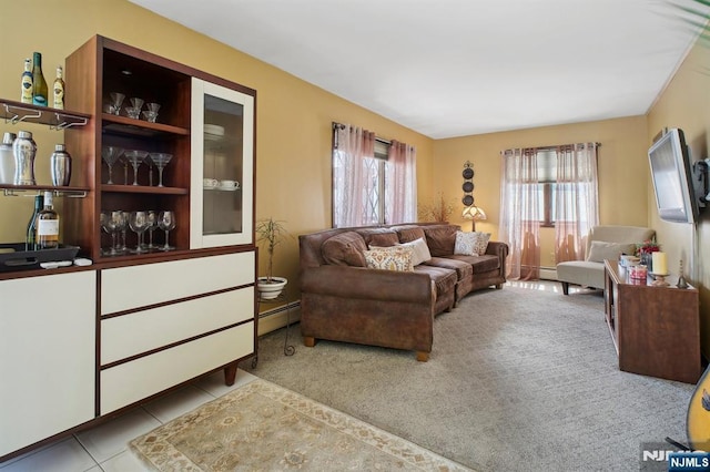 living room featuring tile patterned flooring, a baseboard radiator, and carpet