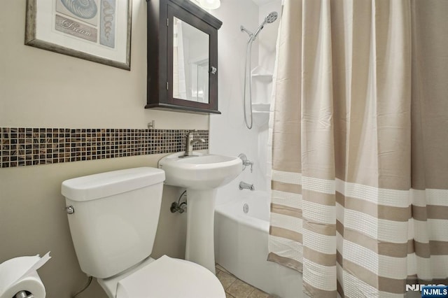 full bath featuring toilet, tile walls, shower / bath combination with curtain, and tile patterned flooring