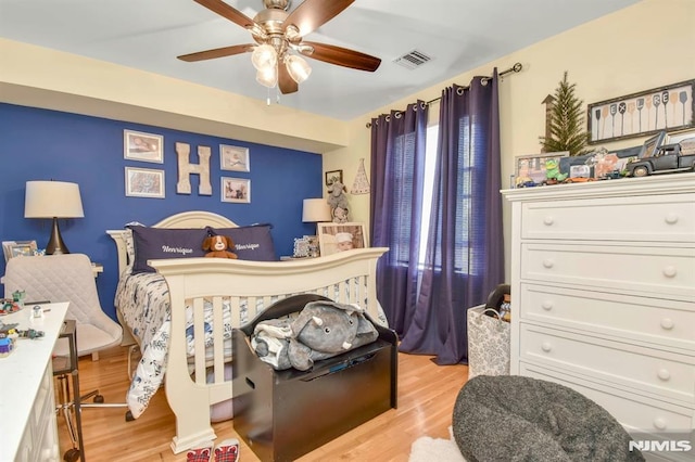 127 Brill St, Newark, NJ 07105 - bedroom with light wood-style flooring and a ceiling fan