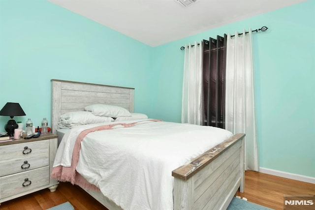 127 Brill St, Newark, NJ 07105 - bedroom featuring dark wood finished floors and baseboards