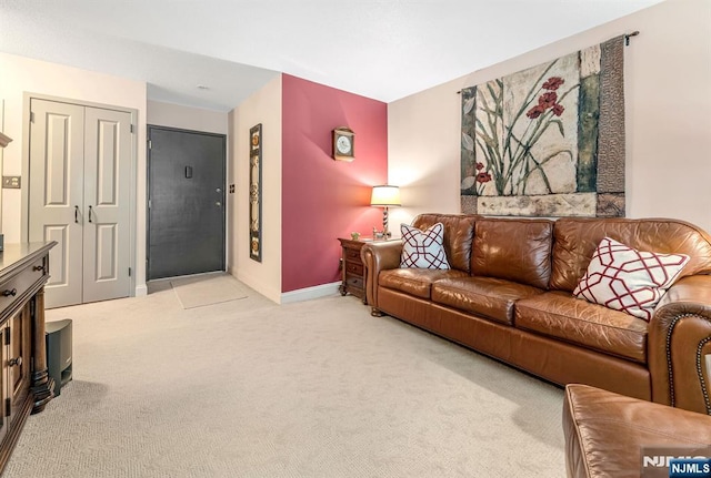 living room with light colored carpet and baseboards