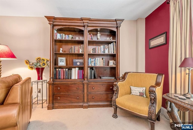 sitting room with carpet flooring and baseboards