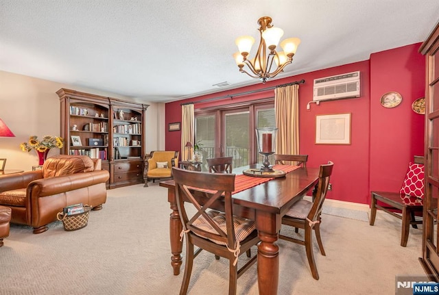 dining space with a wall mounted air conditioner, light carpet, and a chandelier