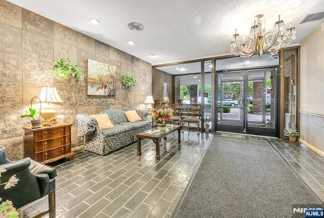 lobby with a textured ceiling and recessed lighting