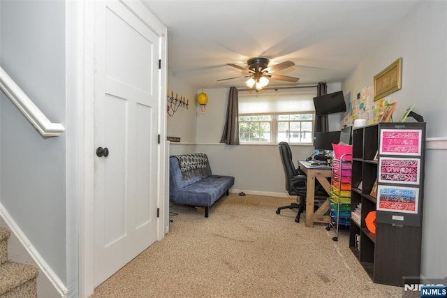office space with carpet, a ceiling fan, and baseboards