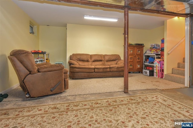 carpeted living area featuring stairs