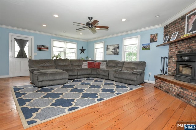 living room with healthy amount of natural light, ornamental molding, hardwood / wood-style floors, a ceiling fan, and recessed lighting