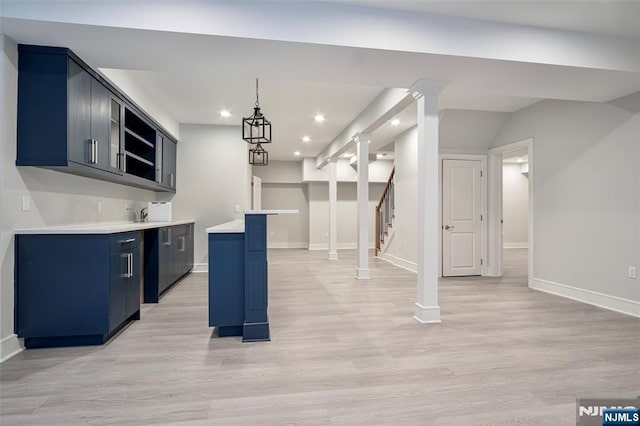 kitchen featuring blue cabinets, recessed lighting, baseboards, light wood-style floors, and light countertops