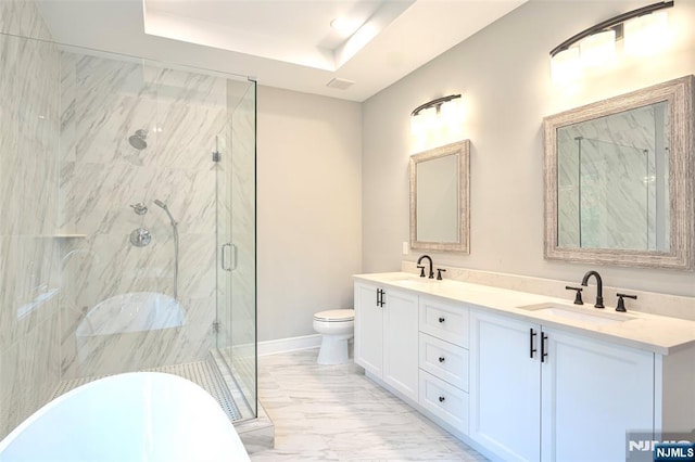 bathroom with marble finish flooring, a marble finish shower, toilet, double vanity, and a raised ceiling
