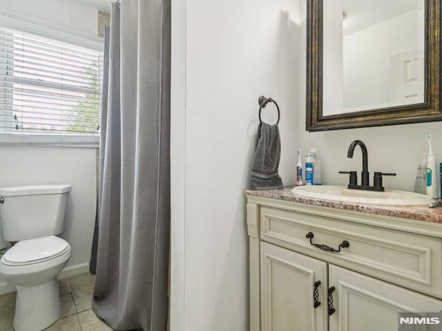 full bathroom with toilet, tile patterned floors, vanity, and a shower with shower curtain