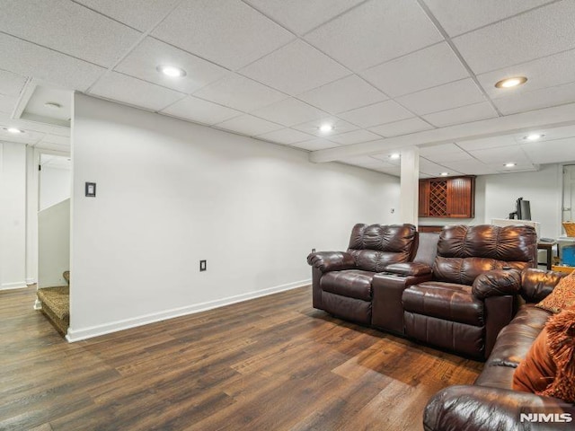 living room featuring wood finished floors, baseboards, recessed lighting, and stairway