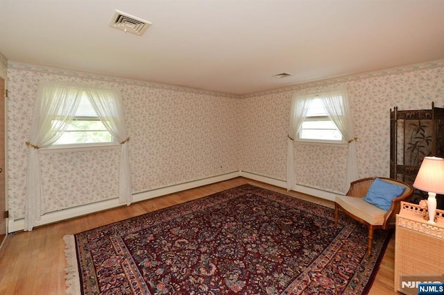 36 Joyce Ln, Wayne, NJ 07470 - sitting room with light wood-type flooring, healthy amount of natural light, and wallpapered walls