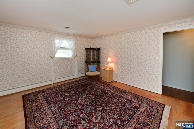 36 Joyce Ln, Wayne, NJ 07470 - empty room featuring wood finished floors and wallpapered walls