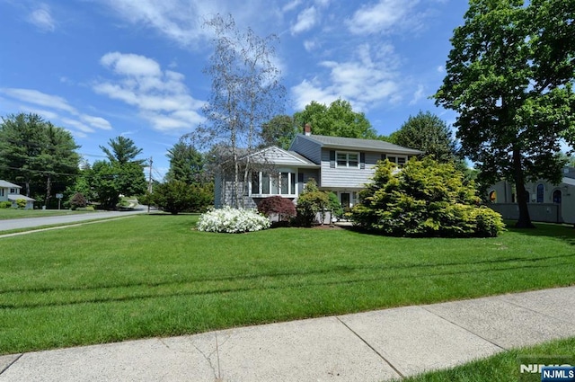 36 Joyce Ln, Wayne, NJ 07470 - split level home with a front yard and a chimney