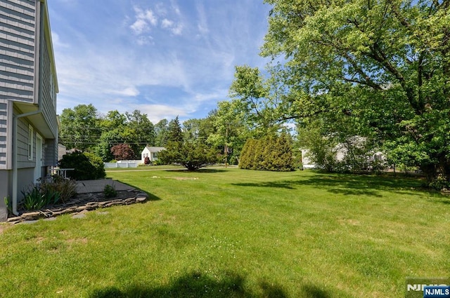 36 Joyce Ln, Wayne, NJ 07470 - view of green lawn with view of wooded area