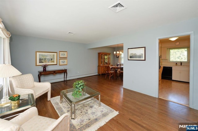 36 Joyce Ln, Wayne, NJ 07470 - living area with a chandelier and wood finished floors