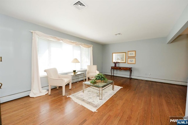 36 Joyce Ln, Wayne, NJ 07470 - living area with wood finished floors and baseboard heating