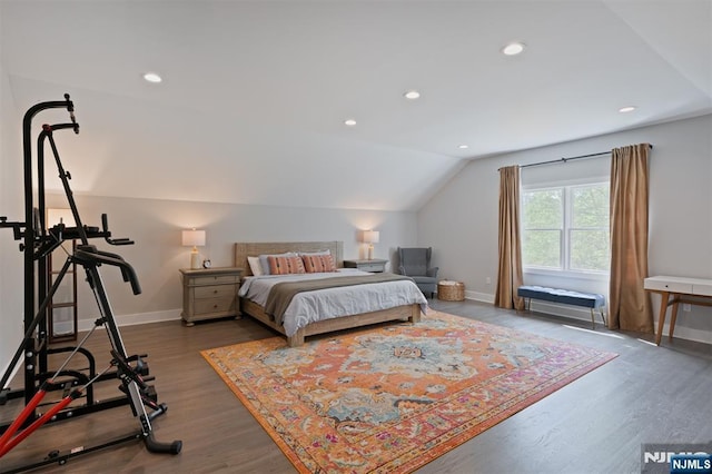 bedroom featuring baseboards, dark wood-style flooring, lofted ceiling, and recessed lighting