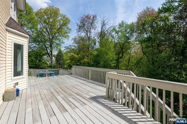 deck with view of scattered trees