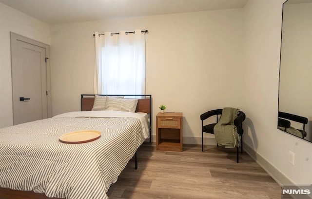 6115 Kennedy Blvd, West New York, NJ 07093 - bedroom featuring wood finished floors and baseboards