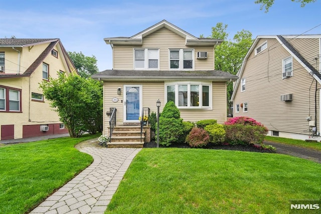 34 Carlisle St, Bergenfield, NJ 07621 - view of front of home with a front lawn and entry steps