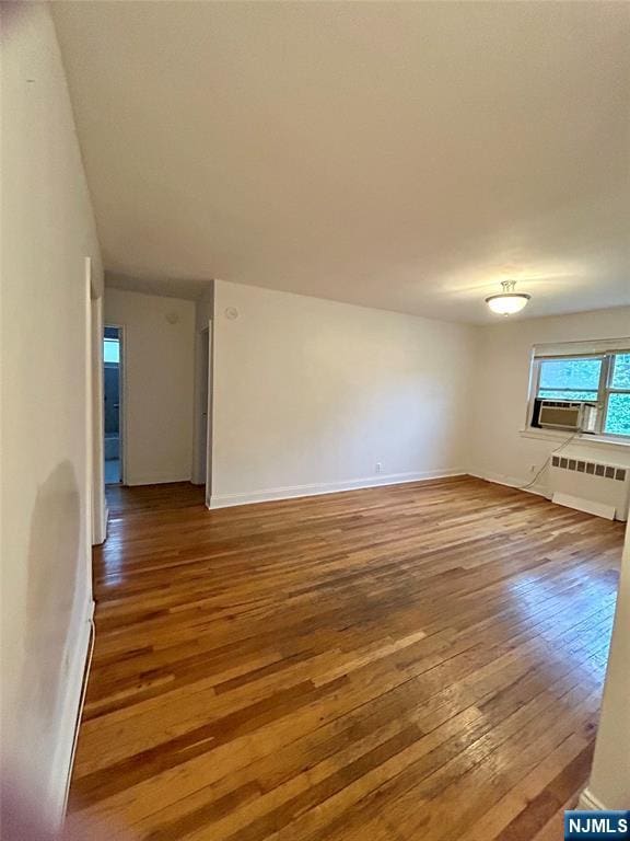 1481 E Terrace Cir Unit 4, Teaneck, NJ 07666 - empty room with hardwood / wood-style flooring, radiator heating unit, and baseboards